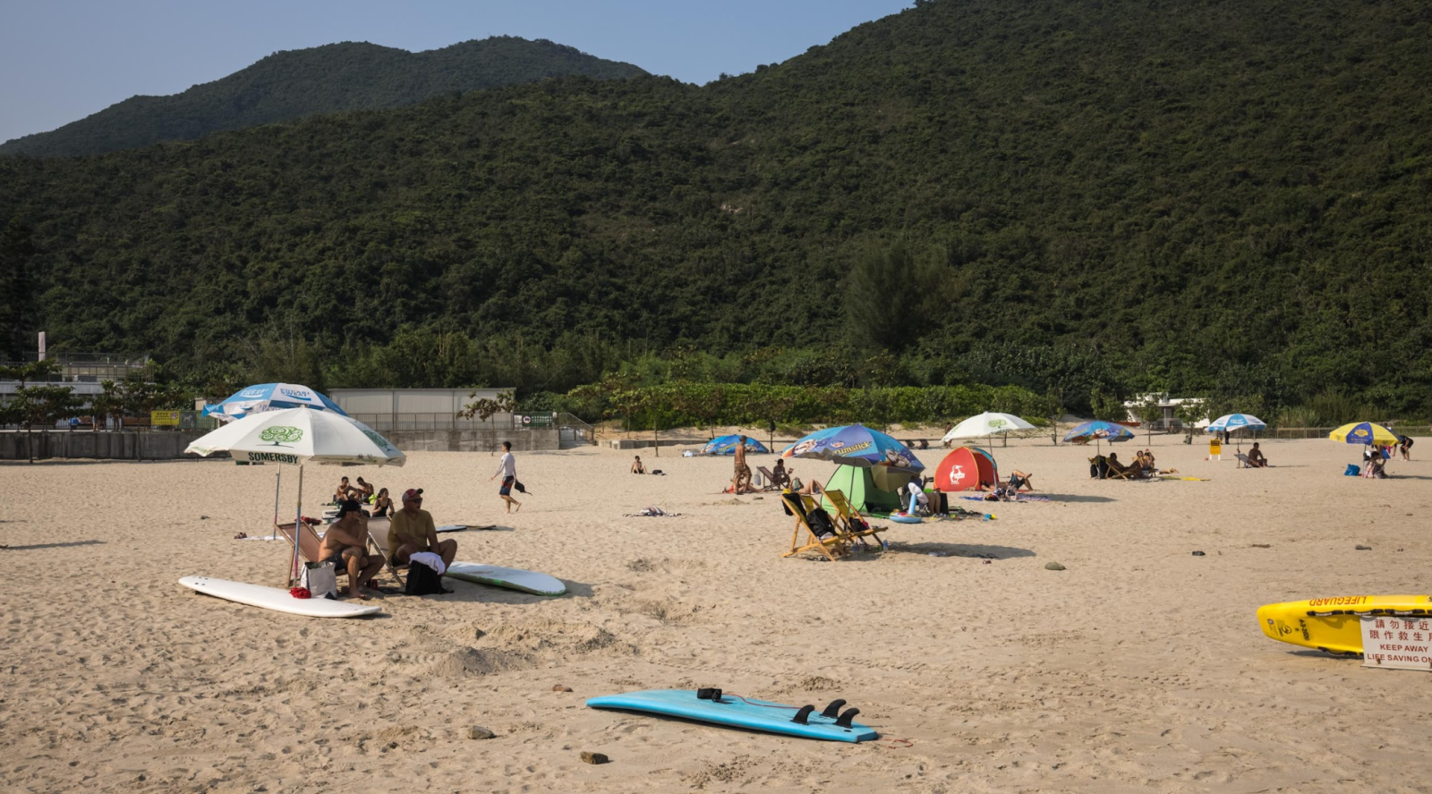Not a sporty guy? Enjoy your time with friends on the white sandy beach!